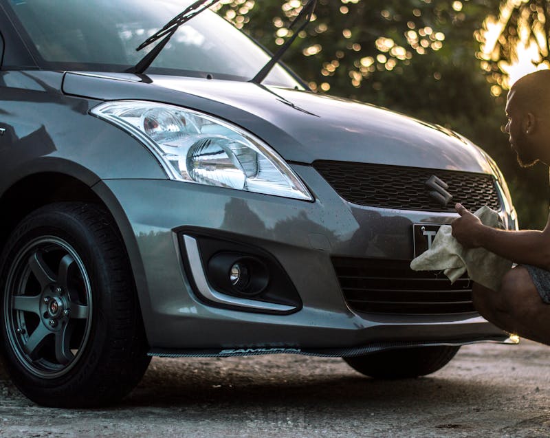 cleaning and waxing the car